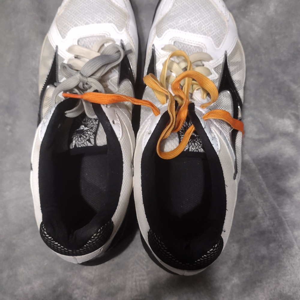 White and Black Athletic Shoes with Orange and Gray Laces